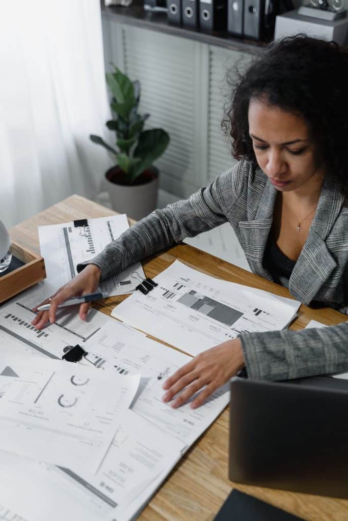 accounting-photo-6694542 Financial analysis of property management documents in a modern office setting.