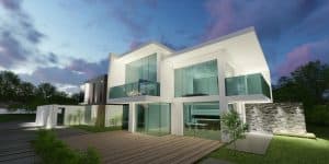 Luxury modern house with large glass windows and outdoor patio, showcasing contemporary architectural design and upscale property management by Rochester Property Management Group.