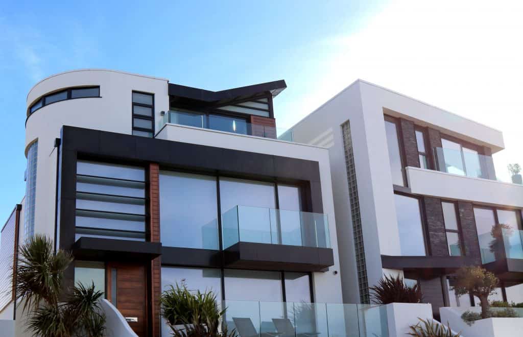 Modern luxury apartment building in Rochester with contemporary design, glass balconies, and spacious windows. Perfect for upscale property management and rental opportunities.